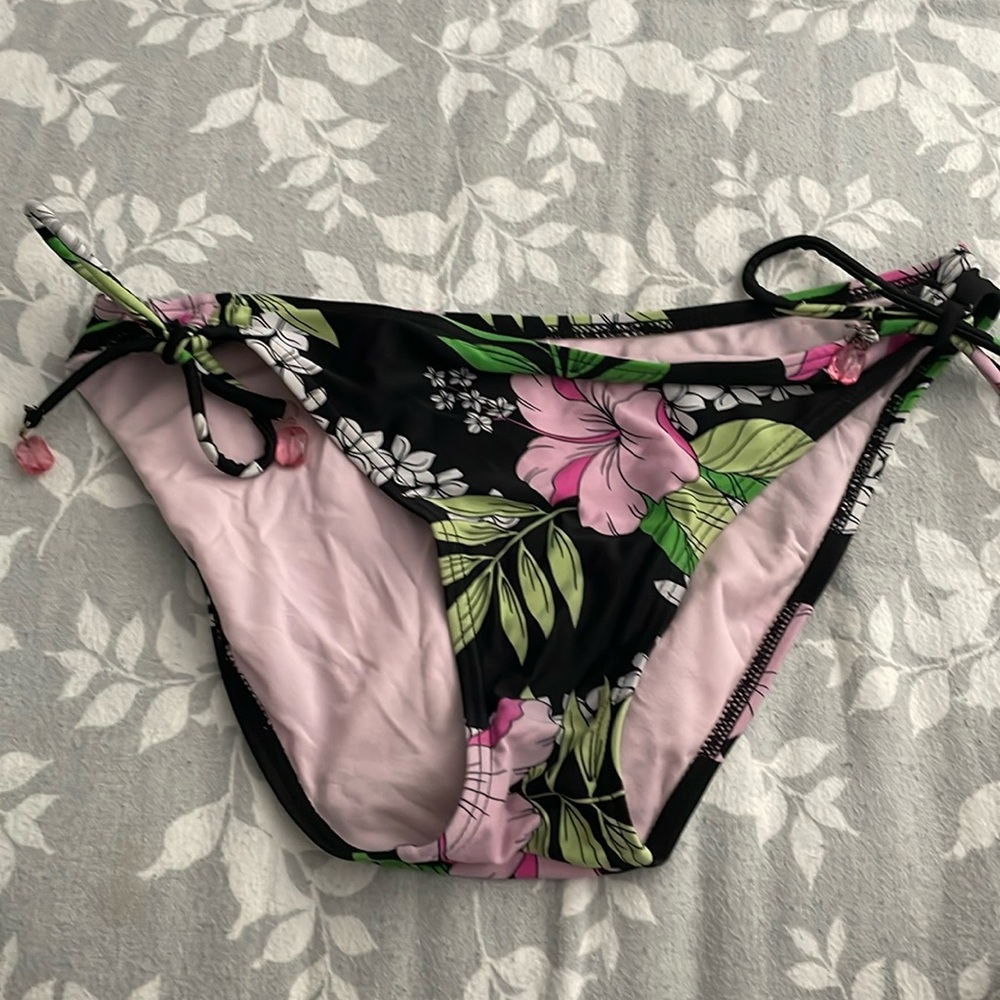 swimming bottoms not my style or size anymore missing gem on one side
